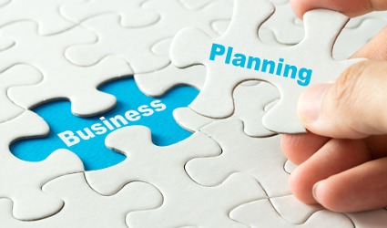 puzzle piece with business planning text